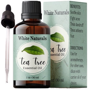 May include: A brown glass bottle with a dropper, labeled "White Naturals Tea Tree Essential Oil" and containing 1 ounce (30 ml) of tea tree oil. The bottle is next to a white box with the same label and information about the benefits and directions for using the oil.