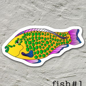 May include: A colorful sticker of a yellow fish with green and pink spots. The fish has a blue eye and a pink and purple tail fin. The sticker is labeled "fish #1".