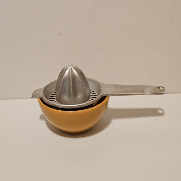 Vintage citrus juicer with handle.  Aluminum Lemon and lime juicer tool with Handle