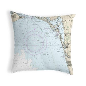 May include: A nautical chart pillow featuring a detailed map of Lake Worth Inlet, Florida. The pillow is printed on a light blue background with brown and black lines and text. The map includes a compass rose and depth soundings.