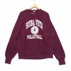 May include: A maroon sweatshirt with the words "BUENA VISTA VOLLEYBALL" and a white volleyball with the number "4" printed on the front.