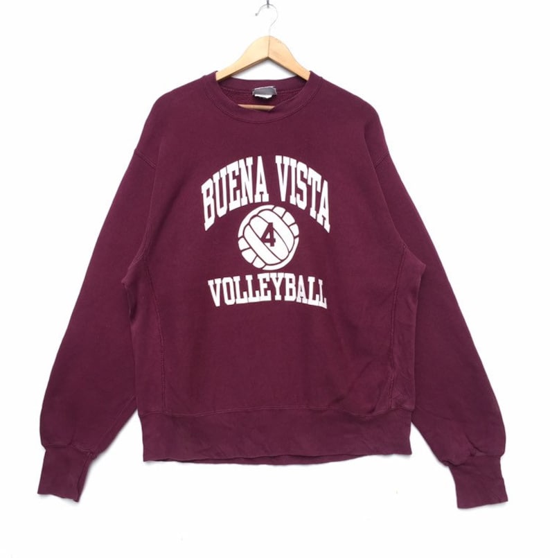 May include: A maroon sweatshirt with the words "BUENA VISTA VOLLEYBALL" and a white volleyball with the number "4" printed on the front.