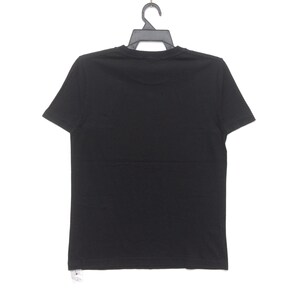 May include: A plain black t-shirt hanging on a black hanger. The short-sleeved shirt is made of a soft material and is displayed against a white background. The back of the shirt is visible.