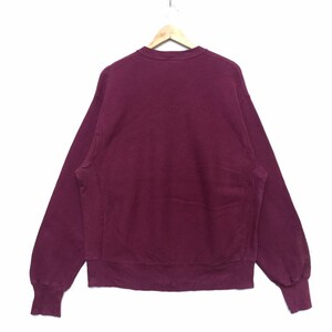 May include: A maroon crew neck sweatshirt with long sleeves and a ribbed hem.