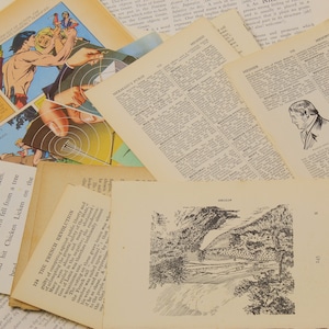 May include: A collection of vintage paper ephemera, including a comic book page with a drawing of a man with a bow and arrow, a page from a dictionary with the word "MERMAID'S" highlighted, and a page from a book with a drawing of a landscape.
