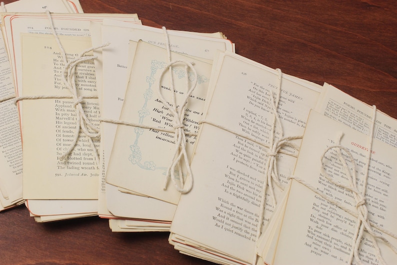 May include: A stack of vintage paperbacks tied together with twine. The pages are yellowed with age and the text is printed in black ink. The books are a mix of poetry and prose.