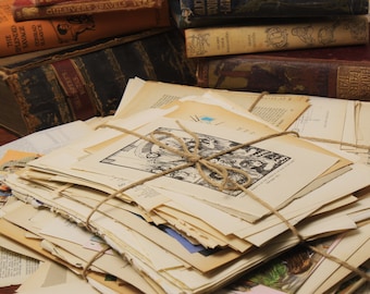 May include: A stack of old, vintage, and antique paper pages tied together with twine. The pages are cream colored and have a worn, aged look. The pages are from old books and magazines. The pages are perfect for crafting, scrapbooking, and other creative projects.