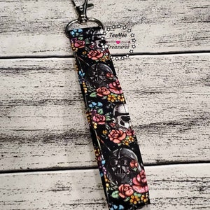 May include: A black and white fabric key chain with a floral pattern and a Darth Vader image. The key chain has a silver metal clip. The text "TeeNee Treasures" is visible in the image.