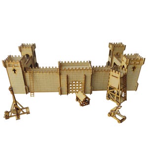 May include: A wooden model castle kit with a drawbridge, towers, and walls. The kit includes a catapult and other siege weapons.