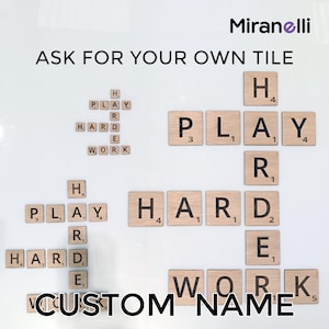 May include: A white background with the words "ASK FOR YOUR OWN TILE" in black text.  Below the text are wooden letter tiles spelling out the words "PLAY HARD WORK" and "CUSTOM NAME".