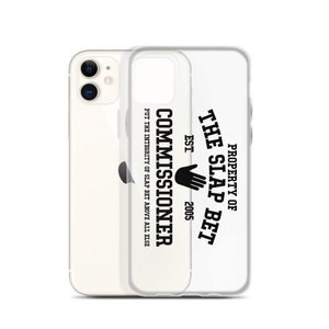 May include: A clear phone case with a black graphic that reads "PROPERTY OF THE SLAP BET EST. 2005 COMMISSIONER PUT THE INTEGRITY OF SLAP BET ABOVE ALL ELSE"