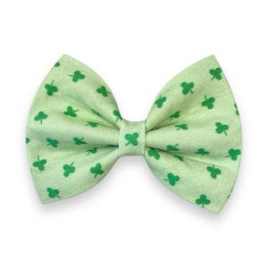 May include: A green bow tie with a shamrock pattern.