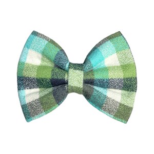 May include: A green, blue and white plaid bow tie.