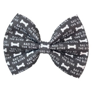 May include: A gray bow tie with a white bone pattern and the text "Bad to the Bone" repeated throughout.