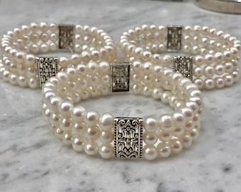 Three Strand Stretchy Pearl Bracelet in White with Metal Amulet