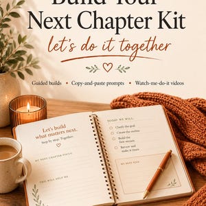 May include: A journal titled "Build Your Next Chapter Kit" with the text "let's do it together." The open journal displays prompts and a pen. A lit candle, a mug of coffee, and a scarf are also visible.