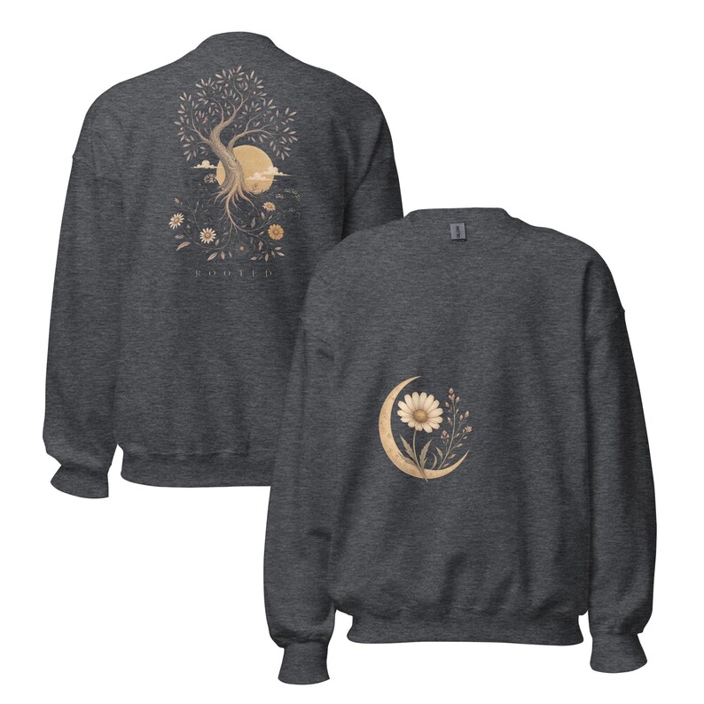 May include: A dark heather gray crewneck sweatshirt featuring a back graphic of a tree with roots, a sun, and flowers with the text "ROOTED" below. The front features a smaller graphic of a single daisy flower centered within a crescent moon.