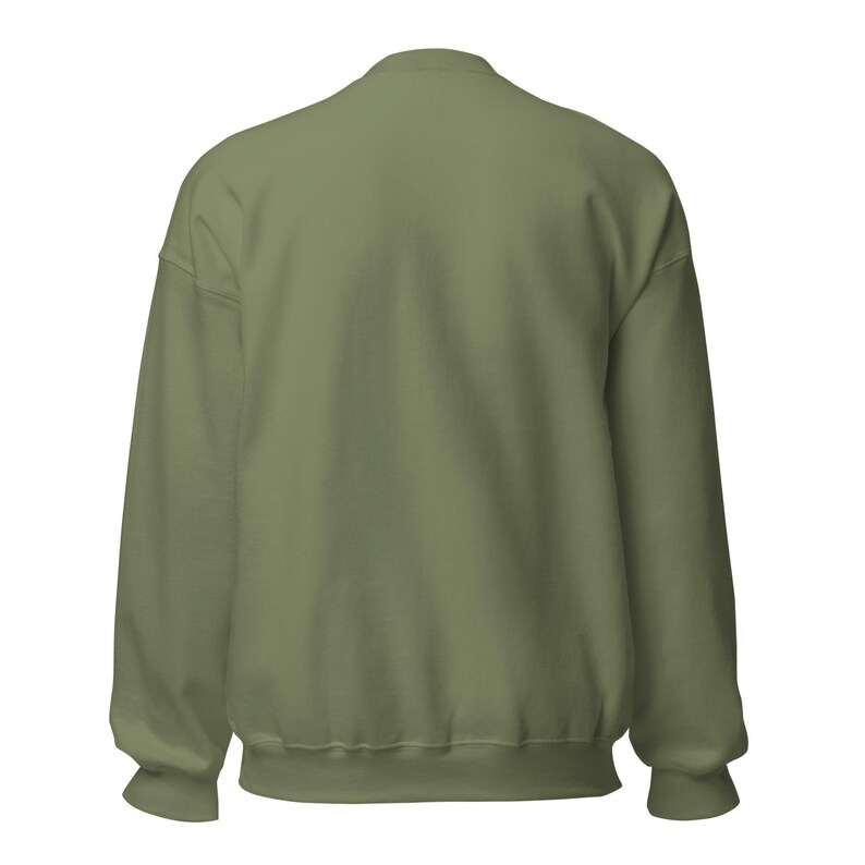 May include: A solid olive green crewneck sweatshirt shown from the back. The garment features long sleeves with ribbed cuffs, a ribbed hemline, and a ribbed collar. The fabric has a smooth, consistent texture throughout the entire back panel.
