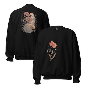 May include: A black crewneck sweatshirt featuring a single orange poppy flower graphic on the front. The back of the sweatshirt displays a larger, detailed illustration of multiple orange poppies, foliage, and a sun, all rendered in muted tones.