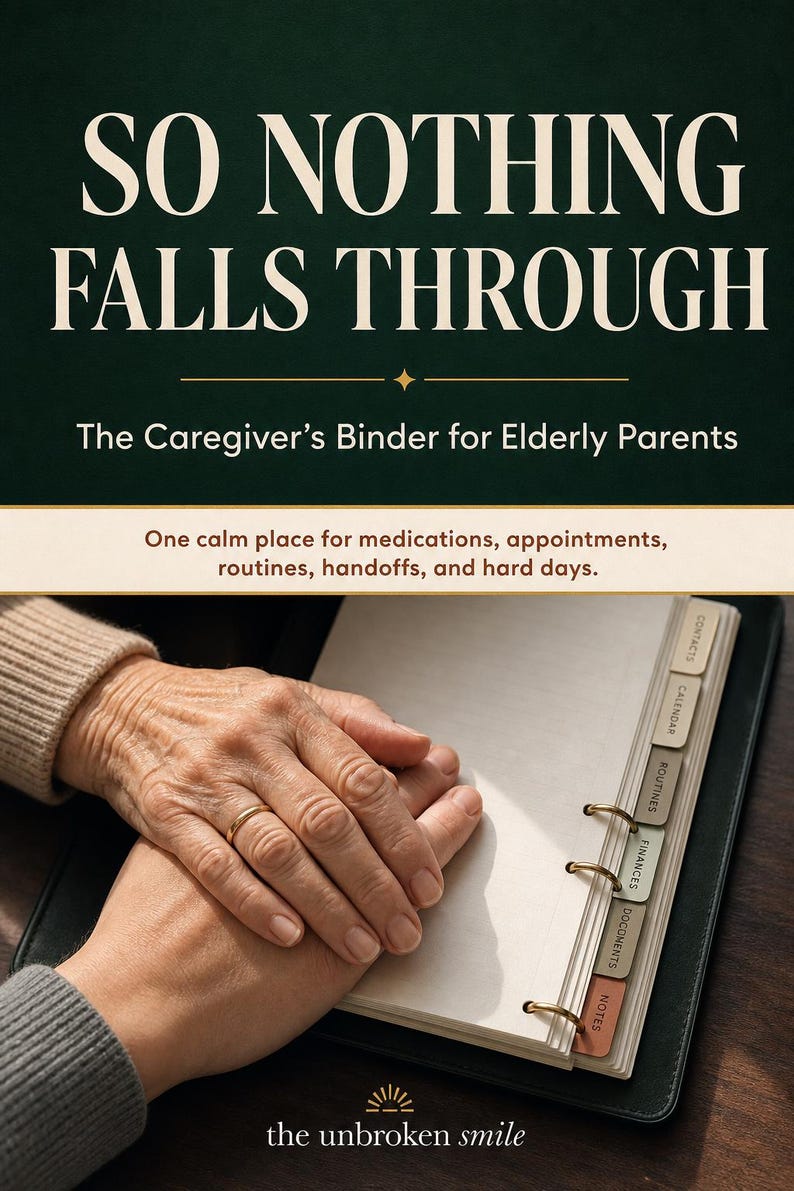 May include: A dark green binder titled SO NOTHING FALLS THROUGH The Caregiver&rsquo;s Binder for Elderly Parents. It features tabbed dividers labeled Contacts, Calendar, Routines, Finances, Documents, and Notes, with the text the unbroken smile at the bottom.