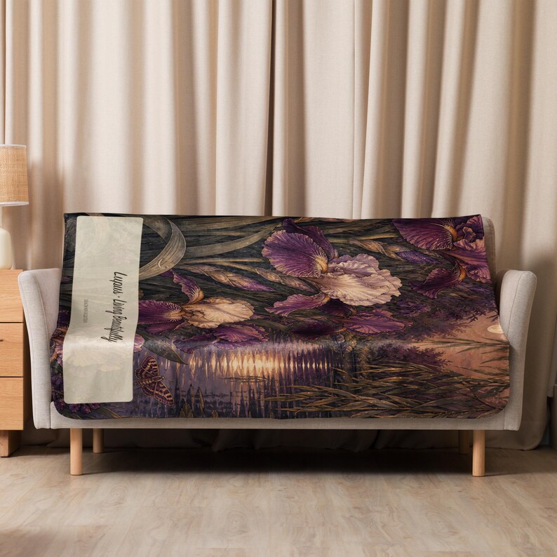 May include: A rectangular throw blanket featuring a dark, atmospheric scene of purple and cream iris flowers near a reflective body of water. A butterfly is visible on the left side, along with a vertical cream-colored banner reading Lupus - Living Beautifully.