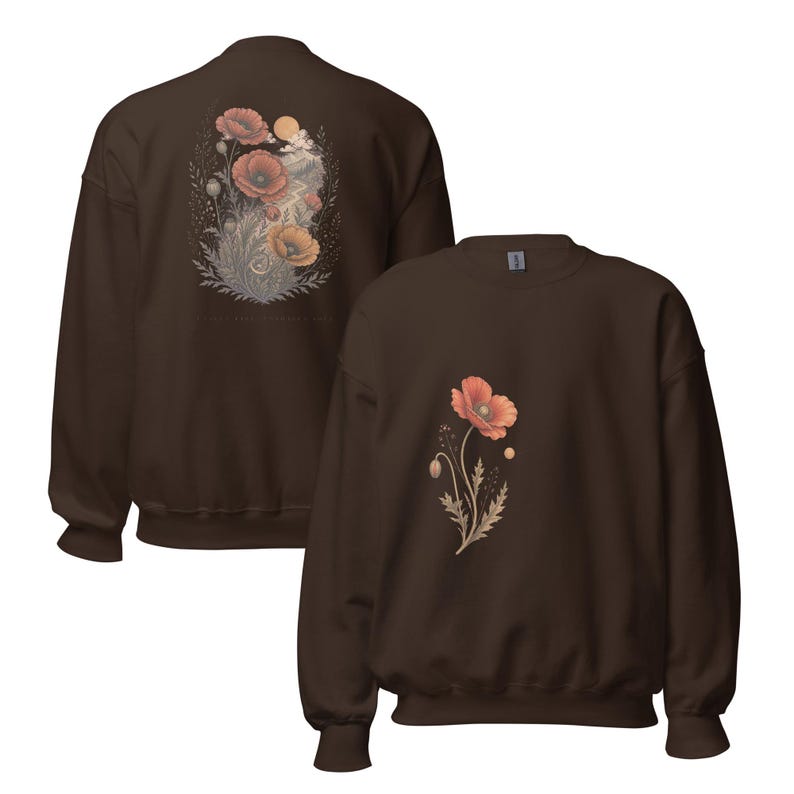 May include: A dark brown crewneck sweatshirt featuring a floral graphic. The front displays a single orange poppy flower with stems and leaves. The back shows a larger, detailed illustration of multiple poppies, foliage, and a sun.