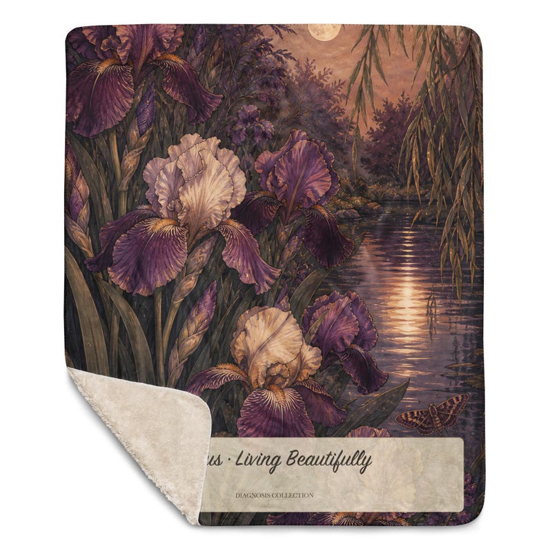 May include: A rectangular throw blanket with a sherpa fleece underside and a printed top featuring purple and white iris flowers by a moonlit river. The text reads "us &middot; Living Beautifully" and "DIAGNOSIS COLLECTION" on a light rectangular patch.