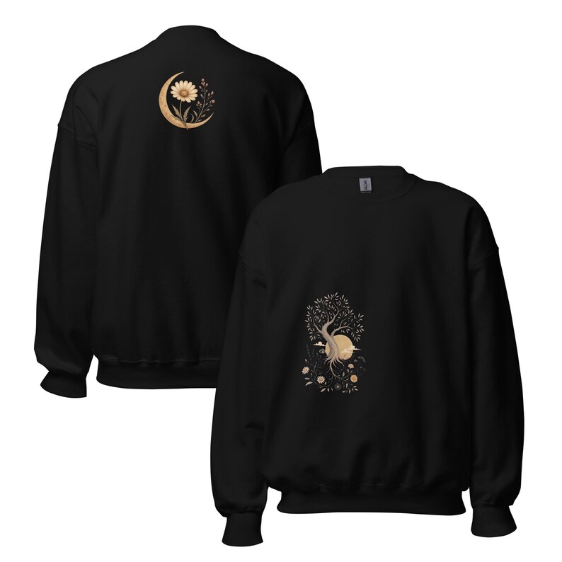 May include: A black long-sleeve sweatshirt featuring a graphic on the front of a tree with roots and a sun, and a graphic on the back of a flower inside a crescent moon. The designs are rendered in shades of beige and cream on the black fabric.
