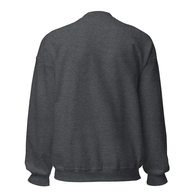 May include: A dark heather gray long-sleeve crewneck sweatshirt featuring a solid, plain back view. The garment is constructed with ribbed cuffs at the wrists and a ribbed hem at the waist, showcasing a consistent, textured fabric throughout the piece.