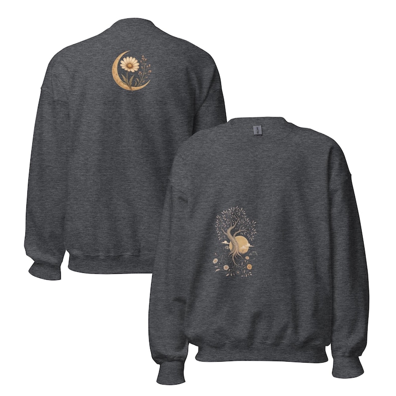 May include: A dark heather gray crewneck sweatshirt featuring two distinct graphic prints. The back view displays a crescent moon with a daisy, while the front view shows a tree with a sun, clouds, and small flowers in muted earth tones.
