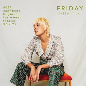 May include: A woman wearing a white blouse with a colourful pattern and green trousers with a red and white pattern. She is sitting on a wooden stool with a red cushion. The text "the Patina Blouse" is at the bottom of the image. The text "#032 confident beginner for woven fabrics XS - 7X" is in the top left corner of the image. The text "FRIDAY pattern co." is in the top right corner of the image.