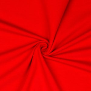 Könnte beinhalten: Nahaufnahme eines leuchtend roten Stoffes mit einem wirbelnden Muster. Der Stoff ist glatt und hat eine weiche Textur.