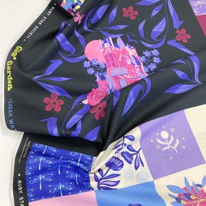 May include: Fabric with diverse patterns. A black section shows a pink castle, flowers, and purple leaves. Other parts display blue dragonflies, pink hearts, and floral designs. The text "Glow Garden" and "Ruby Star Society" are visible on the fabric.
