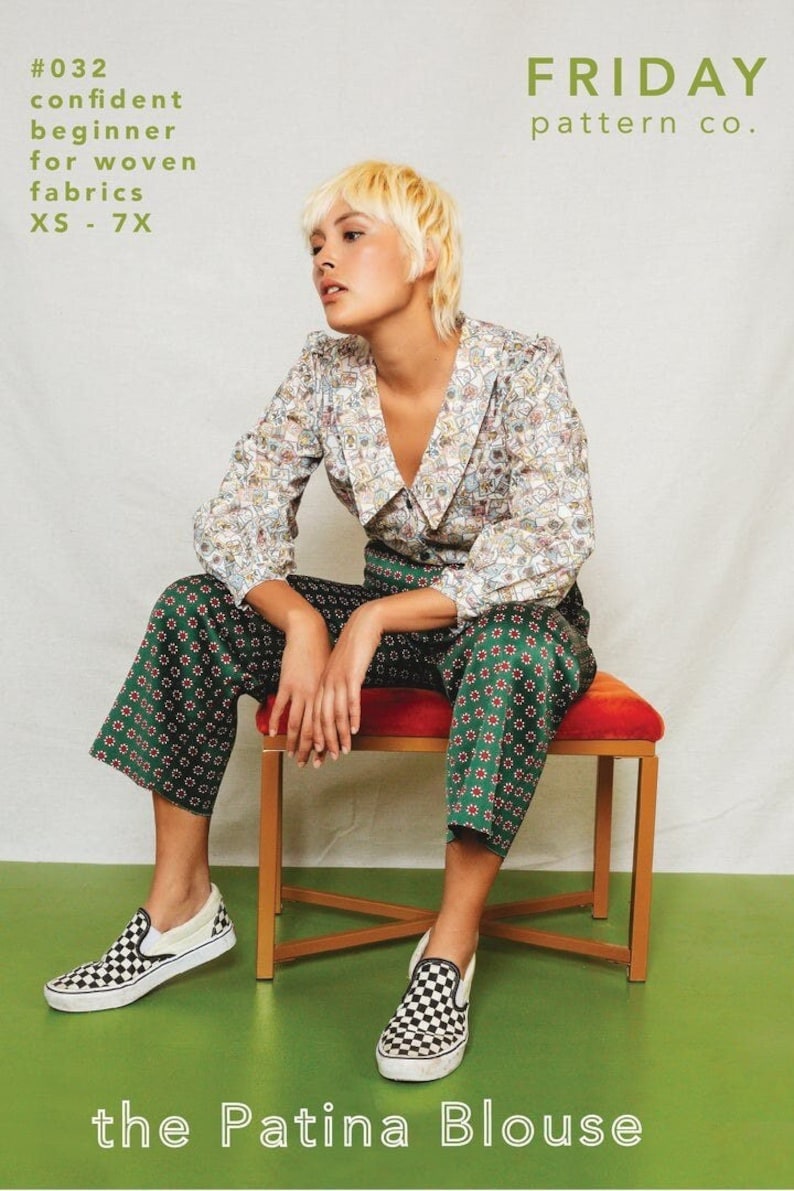 May include: A woman wearing a white blouse with a colourful pattern and green trousers with a red and white pattern. She is sitting on a wooden stool with a red cushion. The text "the Patina Blouse" is at the bottom of the image. The text "#032 confident beginner for woven fabrics XS - 7X" is in the top left corner of the image. The text "FRIDAY pattern co." is in the top right corner of the image.