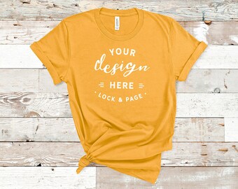 Download Free Gold Bella Canvas 3001 TShirt Mockup Plain Beach House Background Women's Knotted T-Shirt POD Shop Mock Up Flat Lay PSD Template