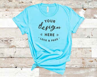 Download Free Aqua Bella Canvas 3001 Tshirt Mockup Plain Beach House Background Women S Knotted T Shirt Pod Shop Mock Up Wood Floor Flat Lay Free Templates Free Download Psd Packaging Mockups PSD Mockup Template
