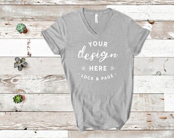 Download Free Athletic Heather Bella Canvas 3005 V-Neck T-Shirt Mockup Flat Lay With Plants On Beach House Wooden Floor Background PSD Template
