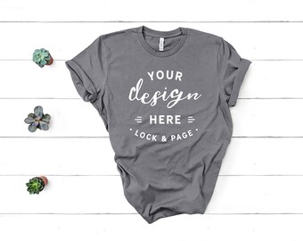 Download Bella Canvas 3001 Storm Unisex Tshirt Mockup Flat Lay Dark Grey Charcoal Rock Color Shirt Mock Up White Wooden Floor Backdrop Free Psd Mockups Freebiesbug PSD Mockup Templates