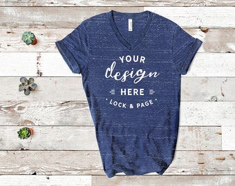 Download Free Navy Marble Bella Canvas 3005 V-Neck T-Shirt Mockup Flat Lay With Plants On Beach House Wooden Floor Background PSD Template