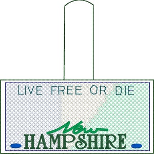May include: A green and blue embroidered patch with the text "Live Free or Die" and "New Hampshire" with a blue circle on each side.
