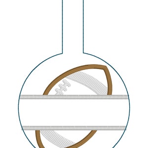May include: A round, blue bauble with a brown football design and a white space for personalisation. The bauble has a loop at the top for hanging.