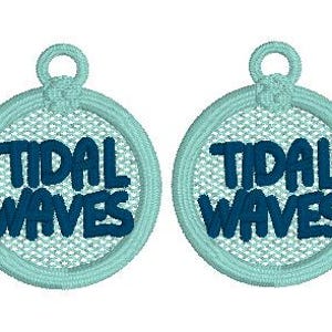 May include: Two round, light blue, embroidered patches with the text "Tidal Waves" in dark blue.