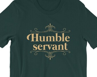 May include: A dark green t-shirt with a gold design that says "Humble servant" in a decorative font.