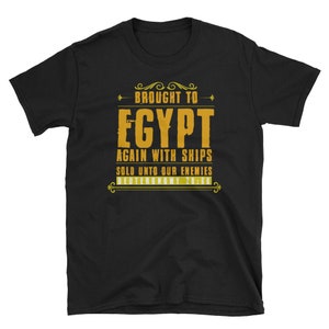 May include: Black t-shirt with a gold graphic that says "Brought to Egypt Again with Ships Sold Unto Our Enemies Deuteronomy 28:68".