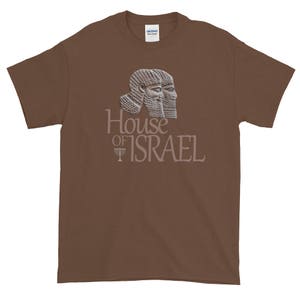 May include: A brown t-shirt with a graphic of two ancient Assyrian figures with the text "House of Israel" and a menorah symbol.