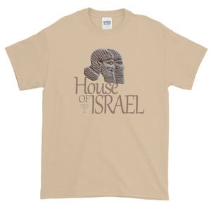 May include: A tan t-shirt with a graphic of two ancient Assyrian figures with the text "House of Israel" printed below.