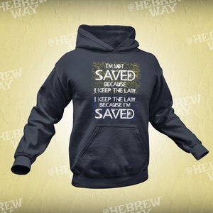 May include: A navy blue hoodie with a white distressed graphic print that reads "I'm not saved because I keep the law. I keep the law because I'm saved."