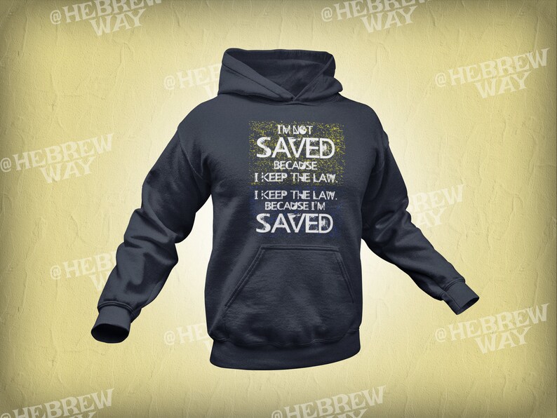 May include: A navy blue hoodie with a white distressed graphic print that reads "I'm not saved because I keep the law. I keep the law because I'm saved."