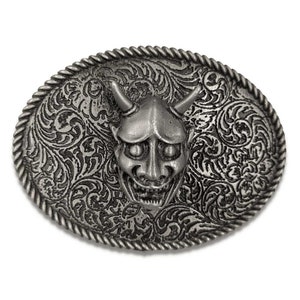May include: Silver-toned belt buckle with an ornate design featuring a demon face in the center.