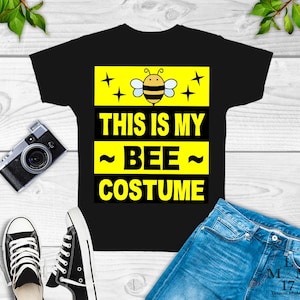 May include: Black t-shirt with a yellow and black bee graphic and the text "This is my ~bee~ costume".